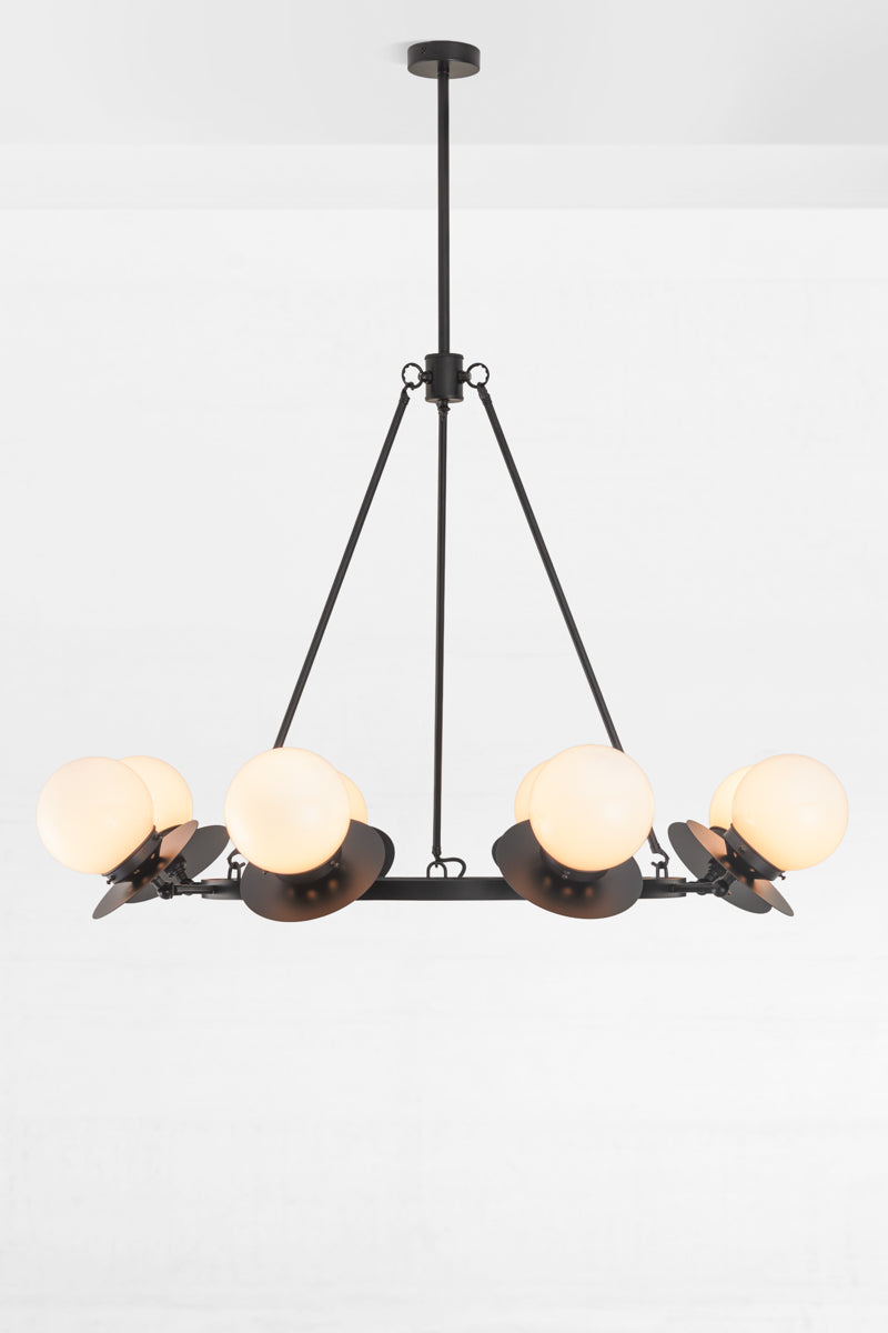 8 light circular chandelier in black with black metal discs and small opal glass ball shades. 