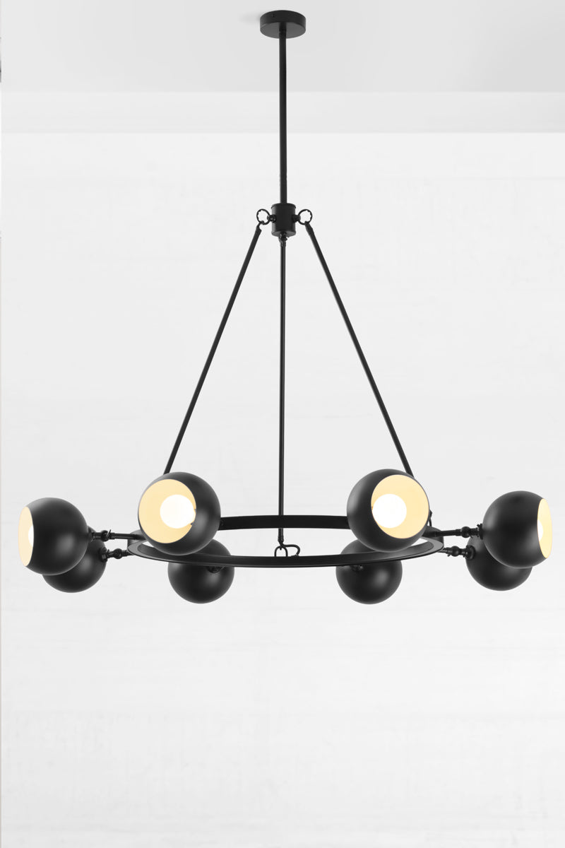 8 light bulb shade circular chandelier in black with white inner shade, with lampholders facing out.