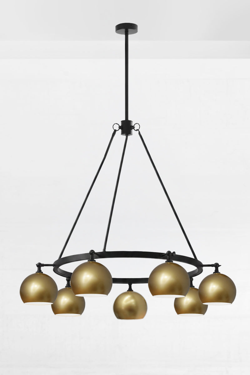 8 light bulb shade circular chandelier in gold brass with black fittings, with lampholders facing down