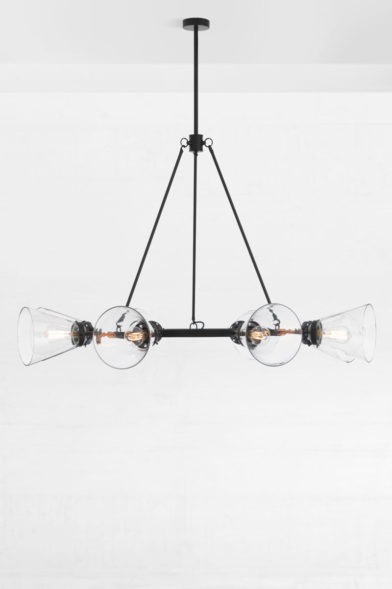 Black 8 light cirlcular chandelier with large clear glass cone shades facing out.