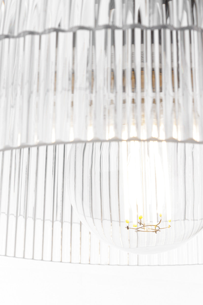 Inner close up of the clear glass shades and bulb. 