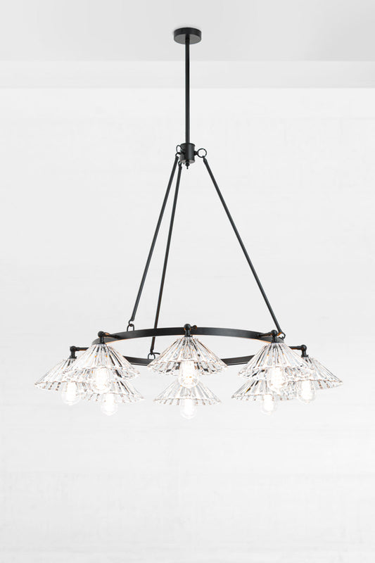 Black 8 light circular chandelier with 8 clear pleated conical shades facing down. 