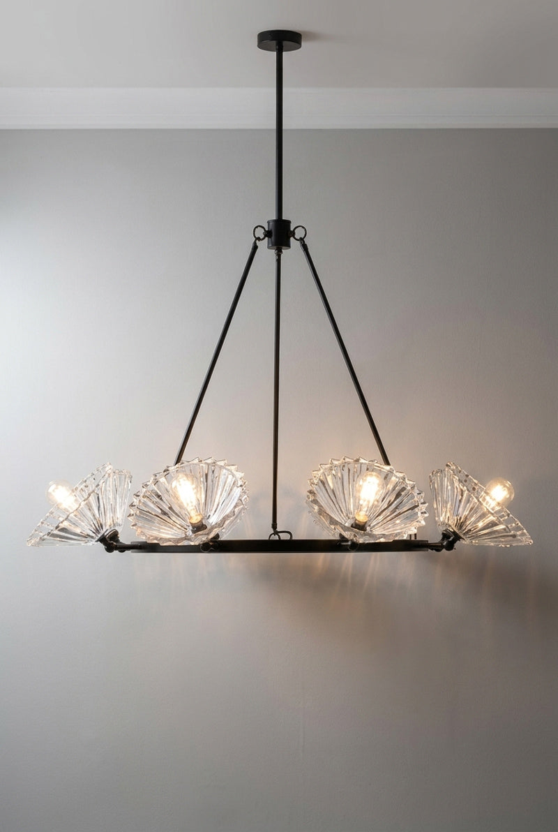 Black 8 light circular chandelier with 8 clear pleated conical shades facing up and out. 