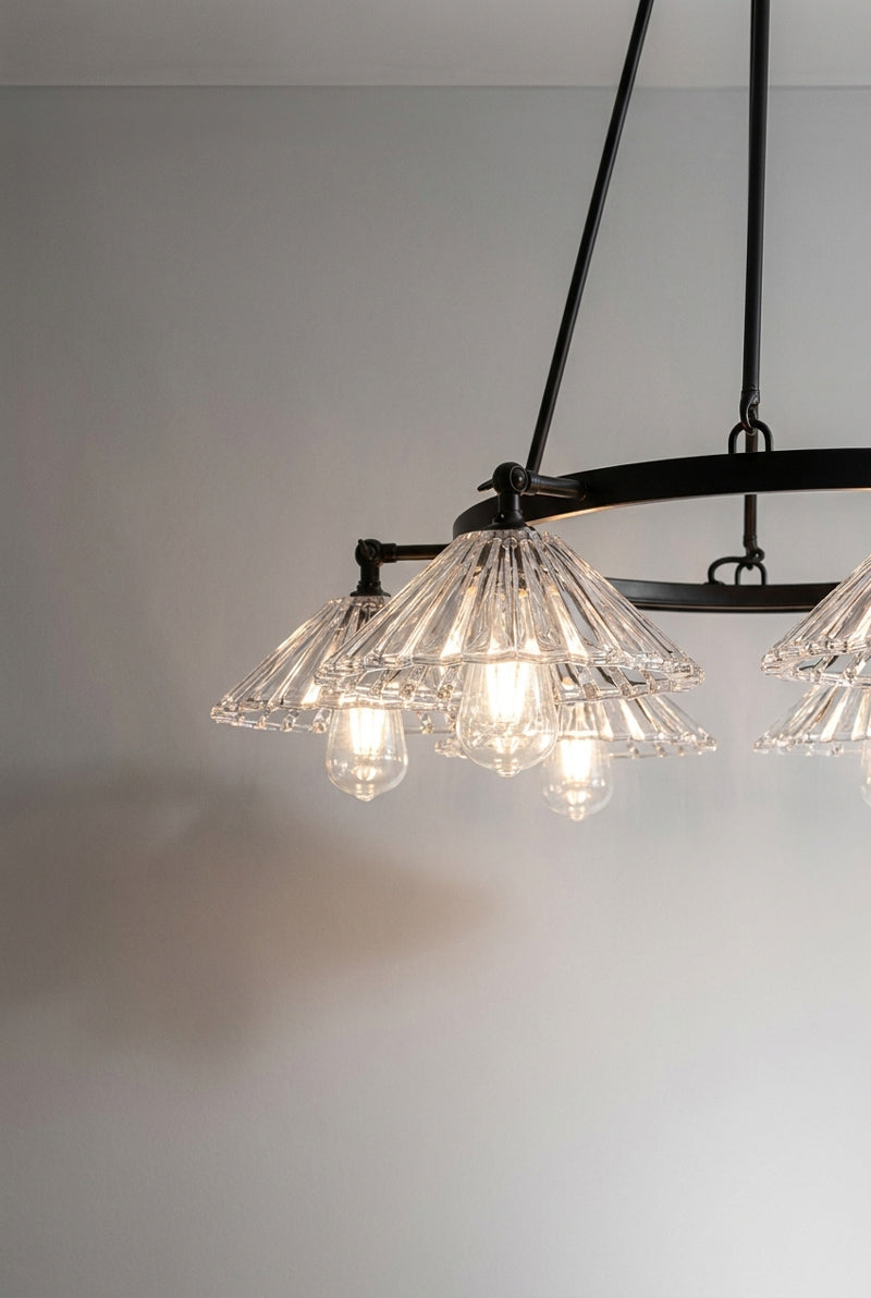 Close up of the clear pleated conical shades facing down. 