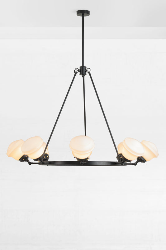 Black circular chandelier with 8 adjustable lampholders, paired with 8 opal schoolhouse style shades. 