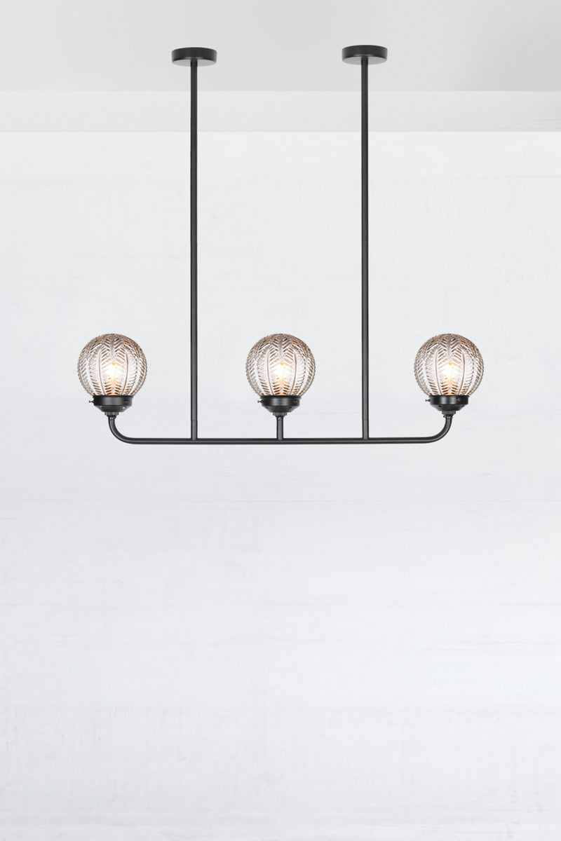 Black 5 light linear chandelier with clear glass ball with vintage designs. 
