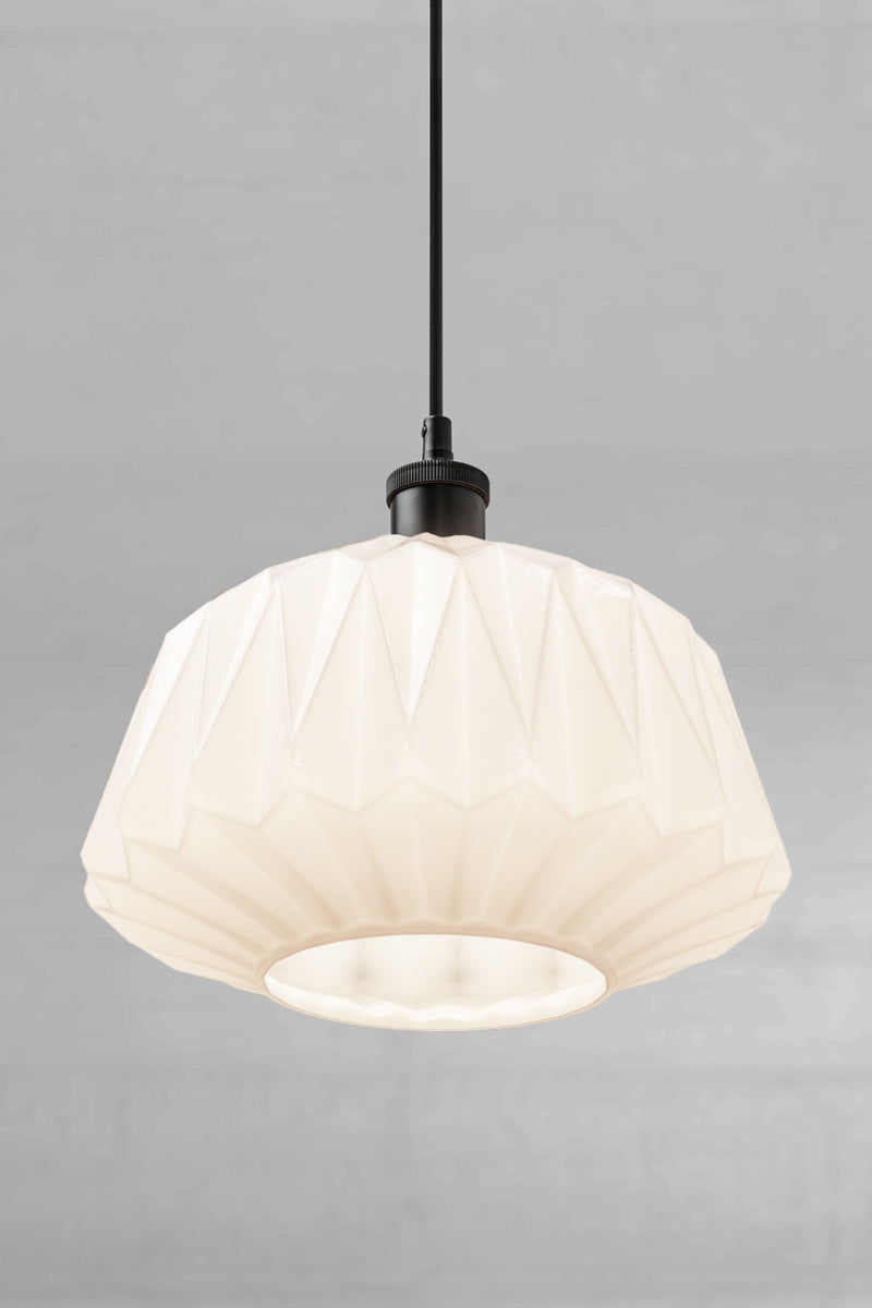 View from under the opal geometric shade with a black lampholder and cord. 