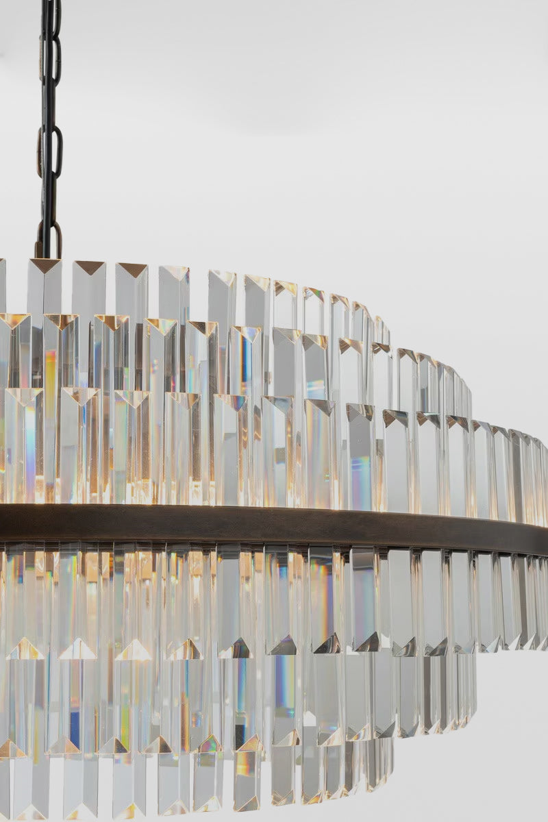 Close up of the three glass prism tiers of the large chandelier. 