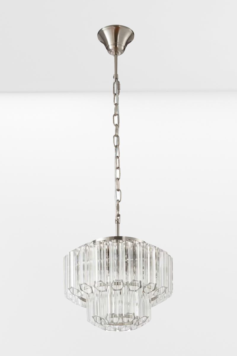 Small glass chandelier with chrome finished metalware, with the lights off.
