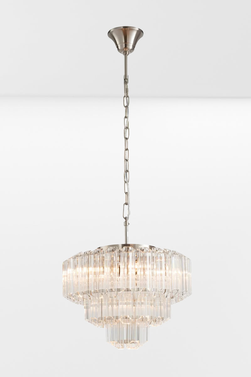 Medium glass chandelier with chrome finished metalware and three tiers.
