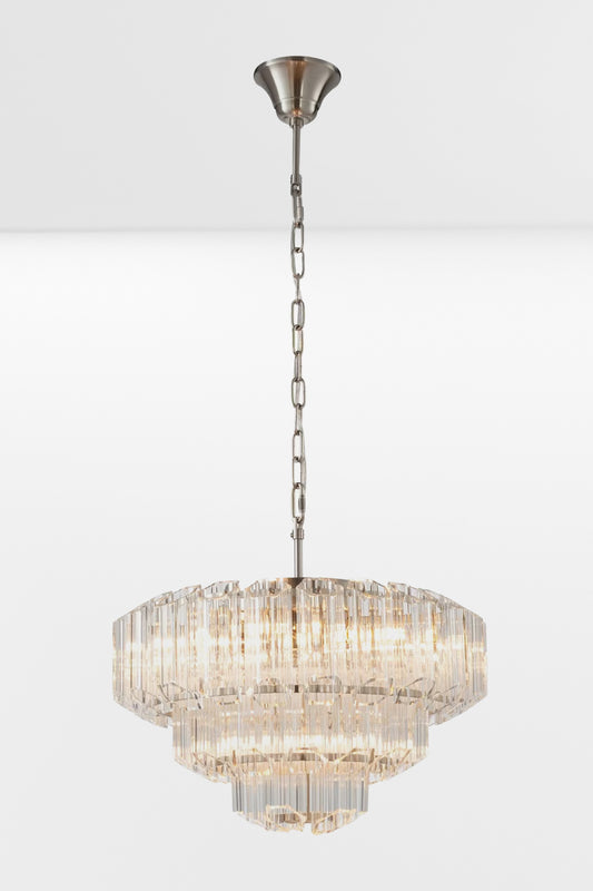 Large glass chandelier with chrome finished metalware and three tiers.