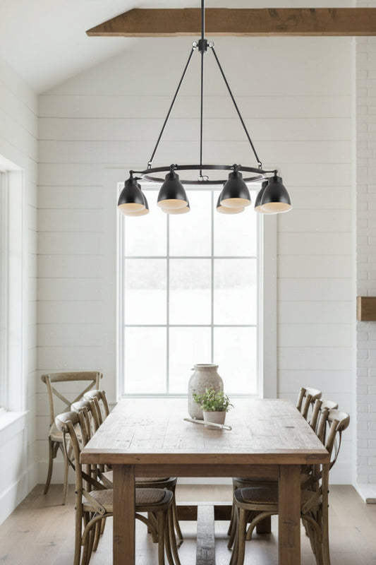8 light cirular chandelier with black steel shades in a barn style dining space