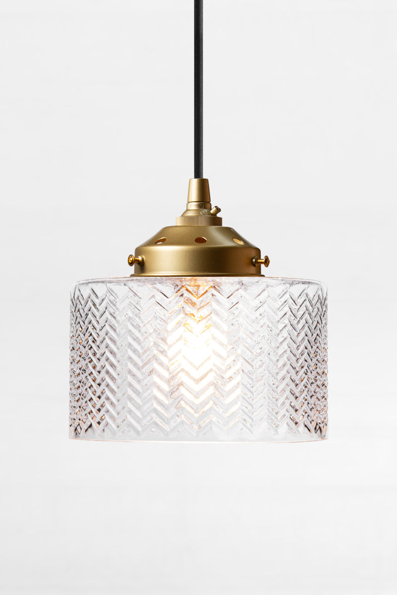 gold brass cord fitting with clear glass shade featuring a wavey chevron pattern