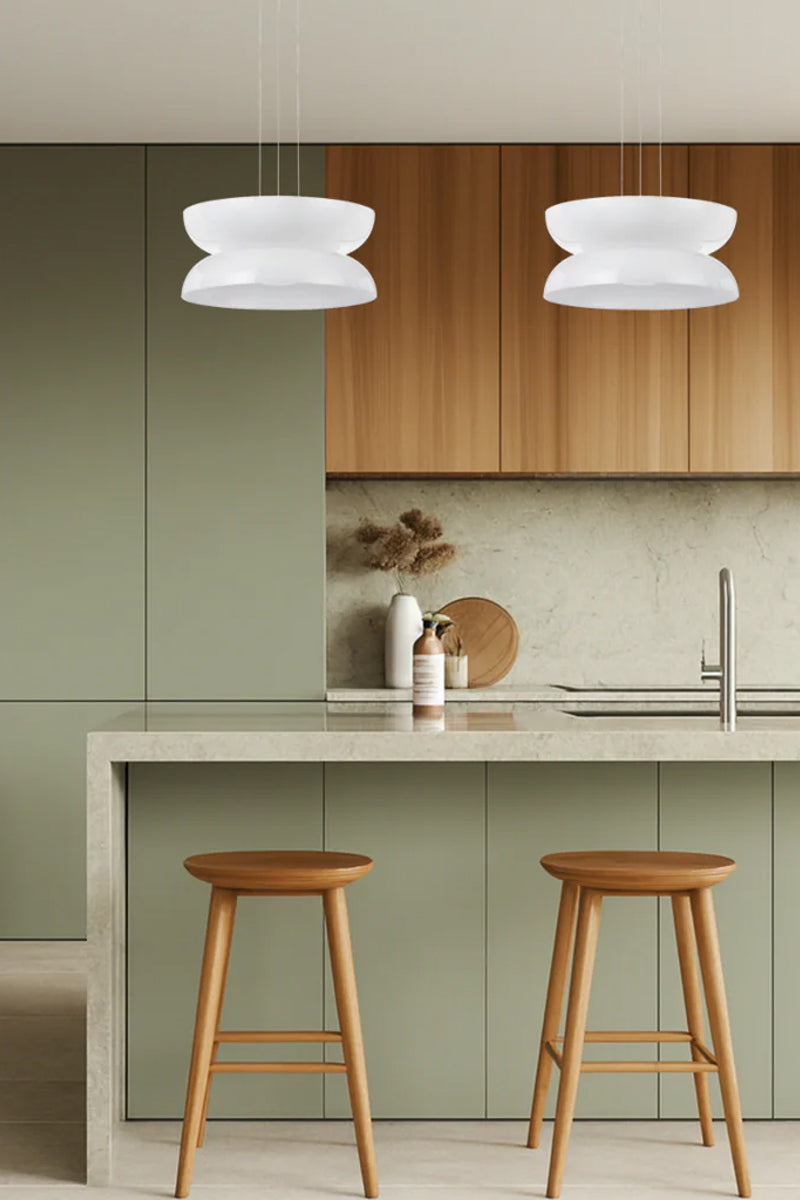 Two version B pendant lights in a modern sage green kitchen. 