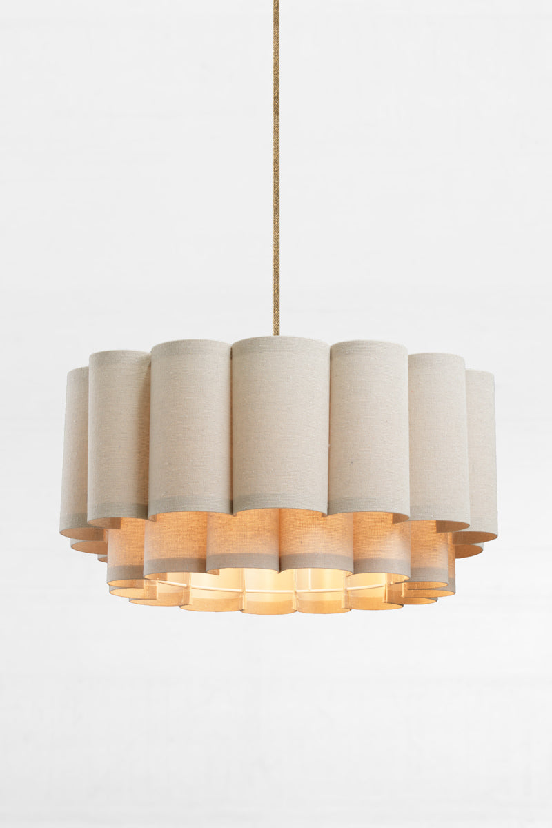 Two tiered shade with scallop form and a neutral-toned fabric to gently diffuse light