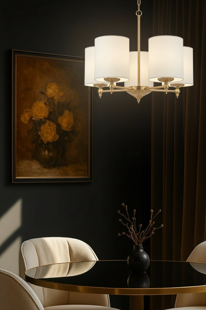 5 light antique gold chandelier with ivory satin shades over a dining space