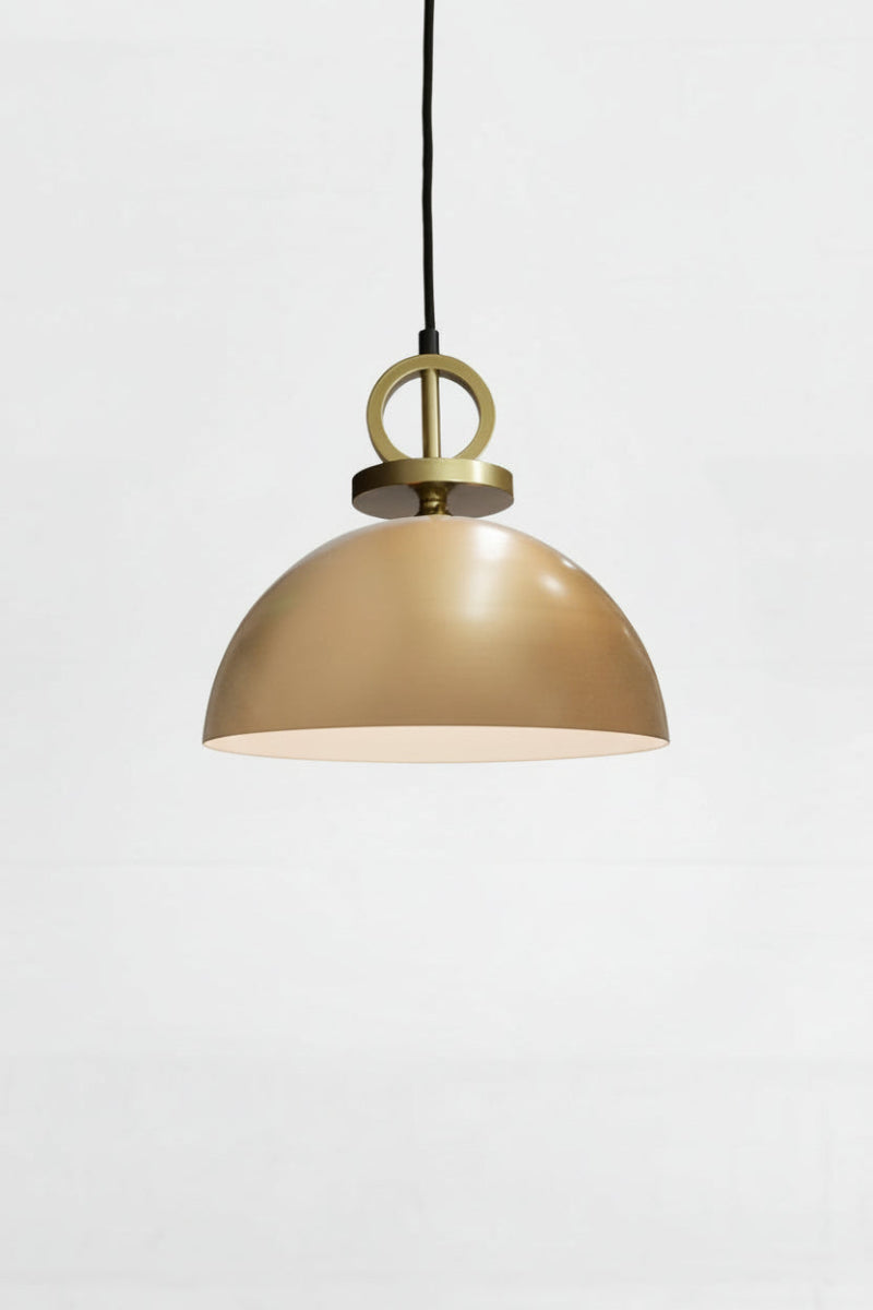 Small gold/brass steel dome shade paired with a black pendant cord with gold/brass disc detailing. 