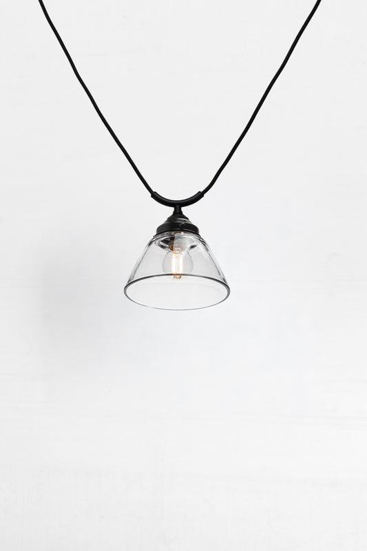 glass shade on Trapeze pendant cord allows multiple pendants to link together and operate from a single switch