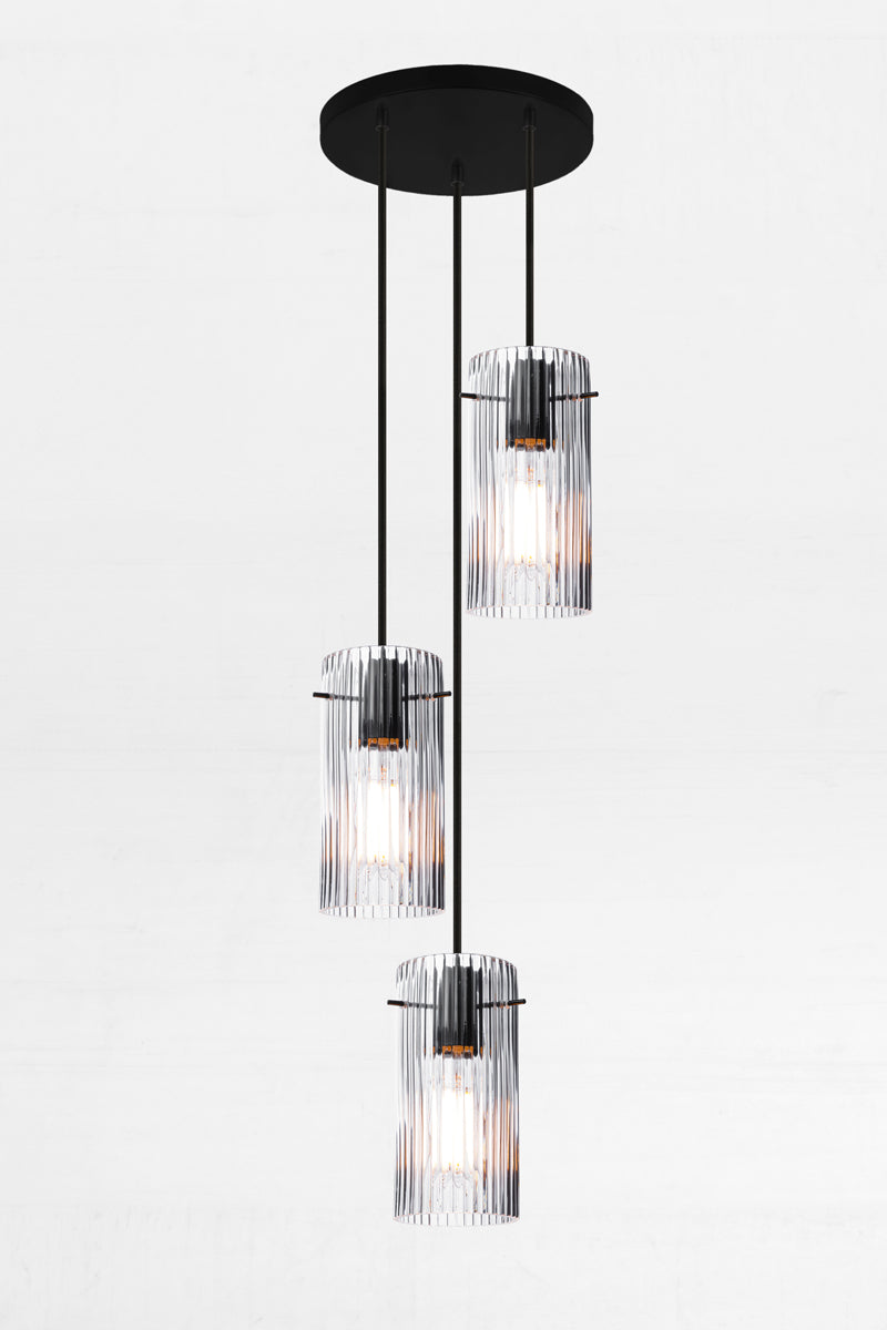 3 drop multi light pendant on a 200mm circular ceiling rose with clear reeded glass shades. 