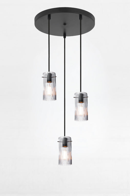 3 drop multi light pendant on a circular ceiling rose with clear reeded glass shades. 