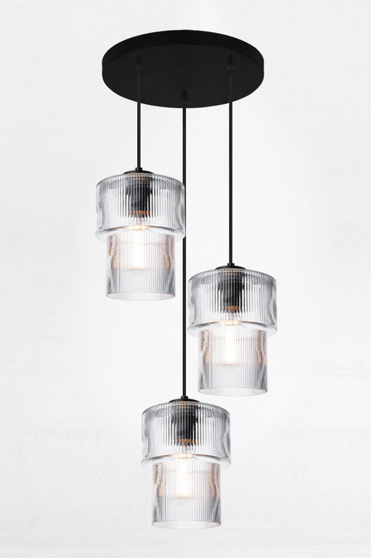 Three drop multi pendant with clear reeded glass shades with a tiered siluette and black hardware on a 400mm ceiling rose. 