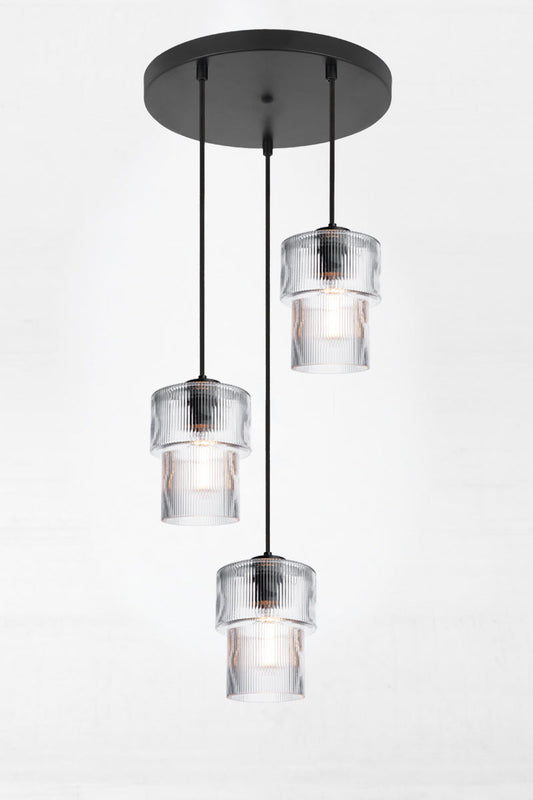 Three drop multi pendant with clear reeded glass shades with a tiere siluette and black hardware. 