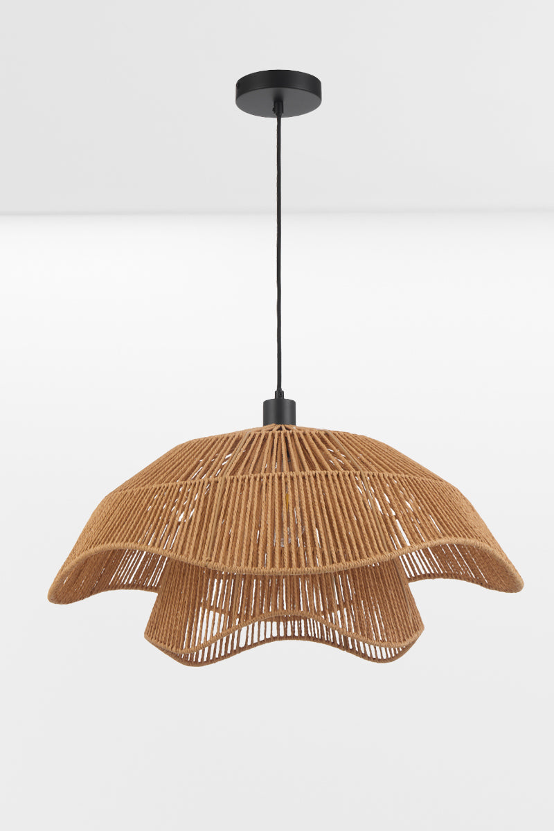 Angled view of the Bribie Rattan Pendant Light highlighting its open weave construction and organic silhouette