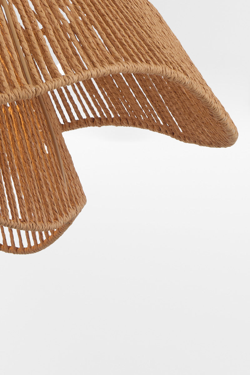 Close-up detail of the Bribie Rattan Pendant Light showing handwoven natural rattan texture and curved edge