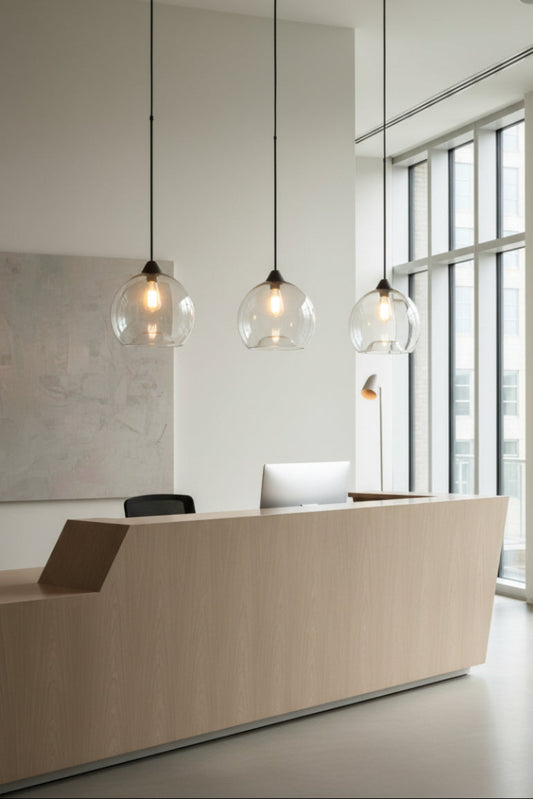 clear glass pendants over reception desk