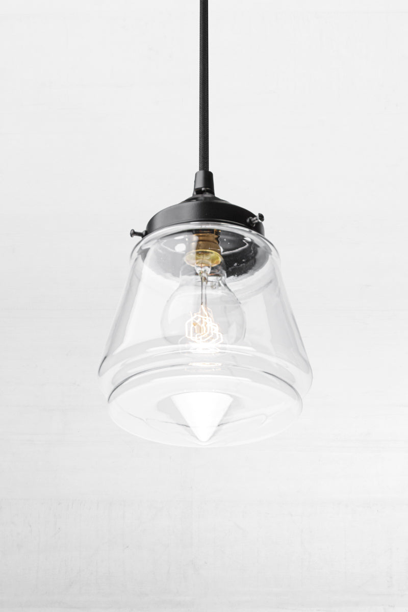 Clear glass Mae Deco Glass Shade paired with a black gallery and cloth cord. 