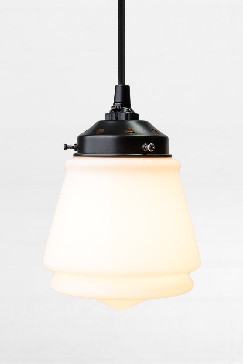 Opal glass Mae Deco Glass Shade paired with a black gallery and cloth cord.