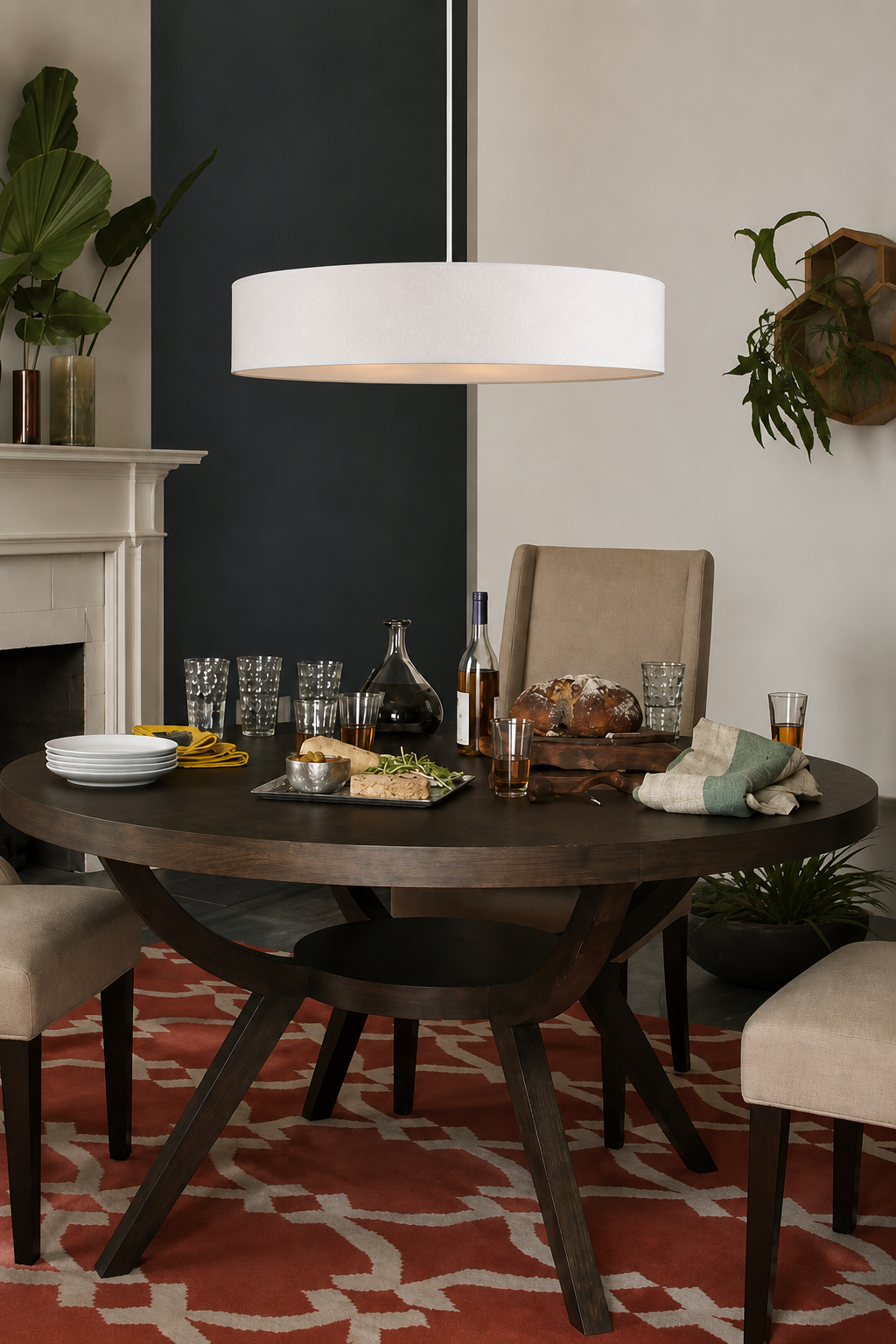 Clemente white fabric drum pendant light suspended above a round dining table in a contemporary dining room.