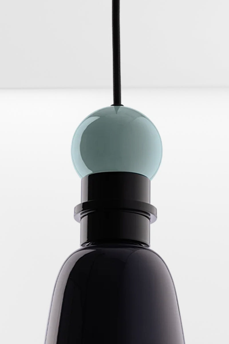 Close up detail of the Putnam Pendant Light Style B featuring mist blue sphere detail and glossy navy blue aluminium shade