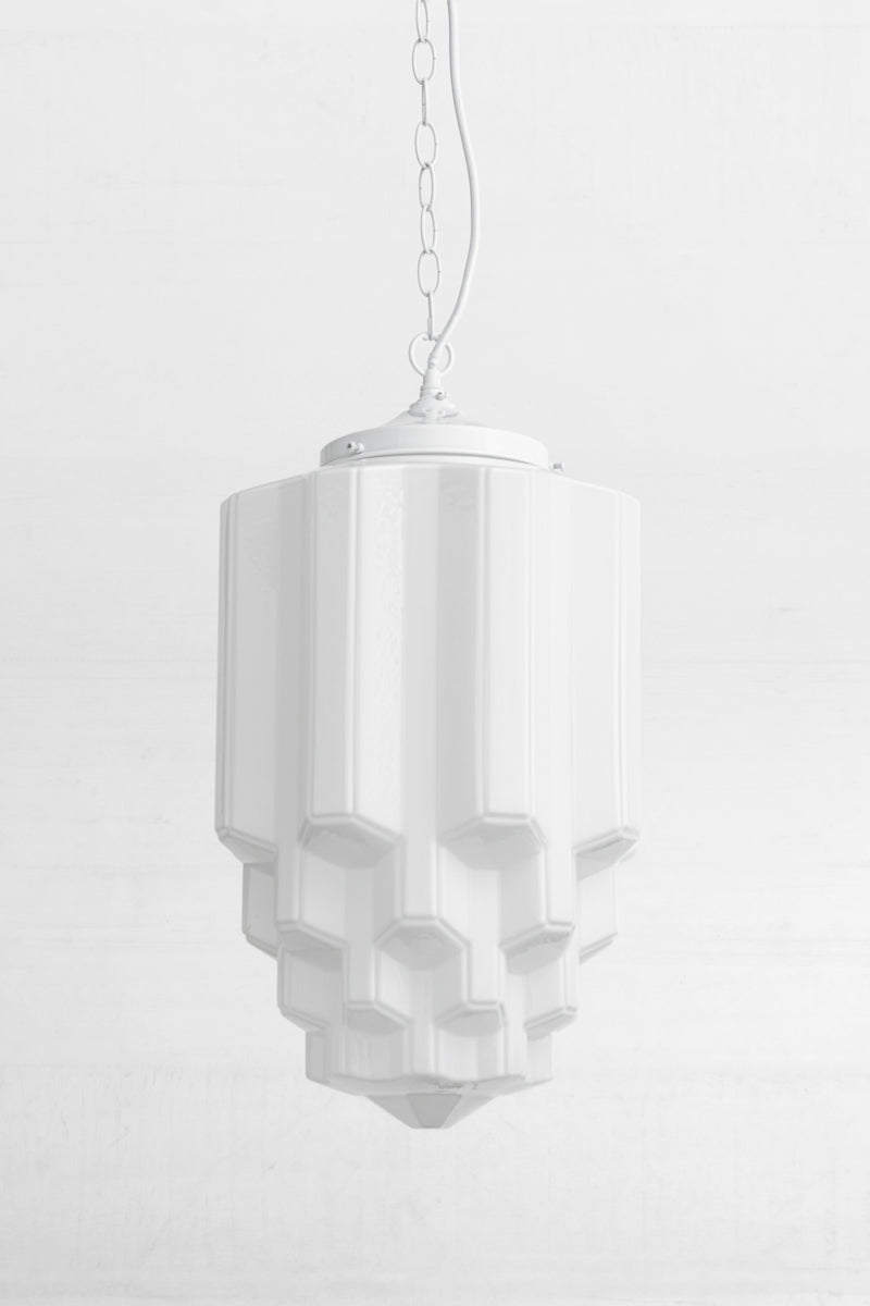 white fitting on art deco design reflects quintessential Art Deco aesthetic and modern craftsmanship.