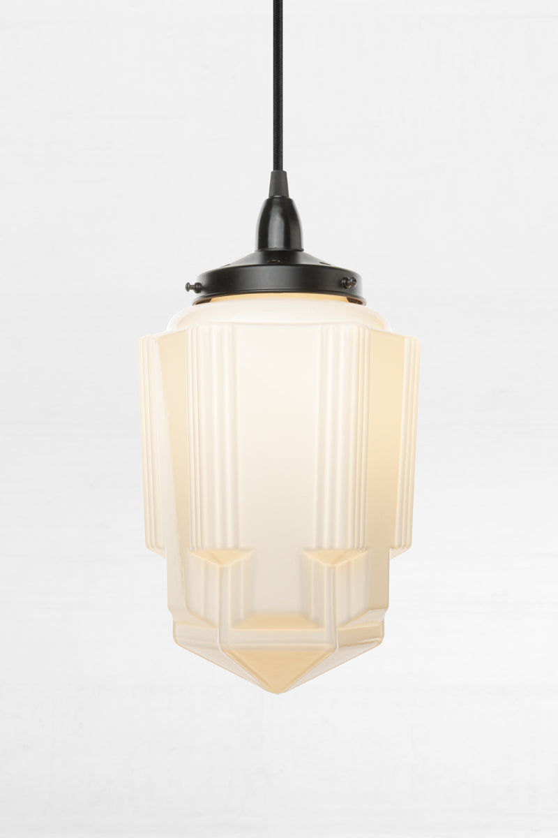 bespoke Art Deco glass shade stands out with a distinctive pointed silhouette with sharp angular lines.