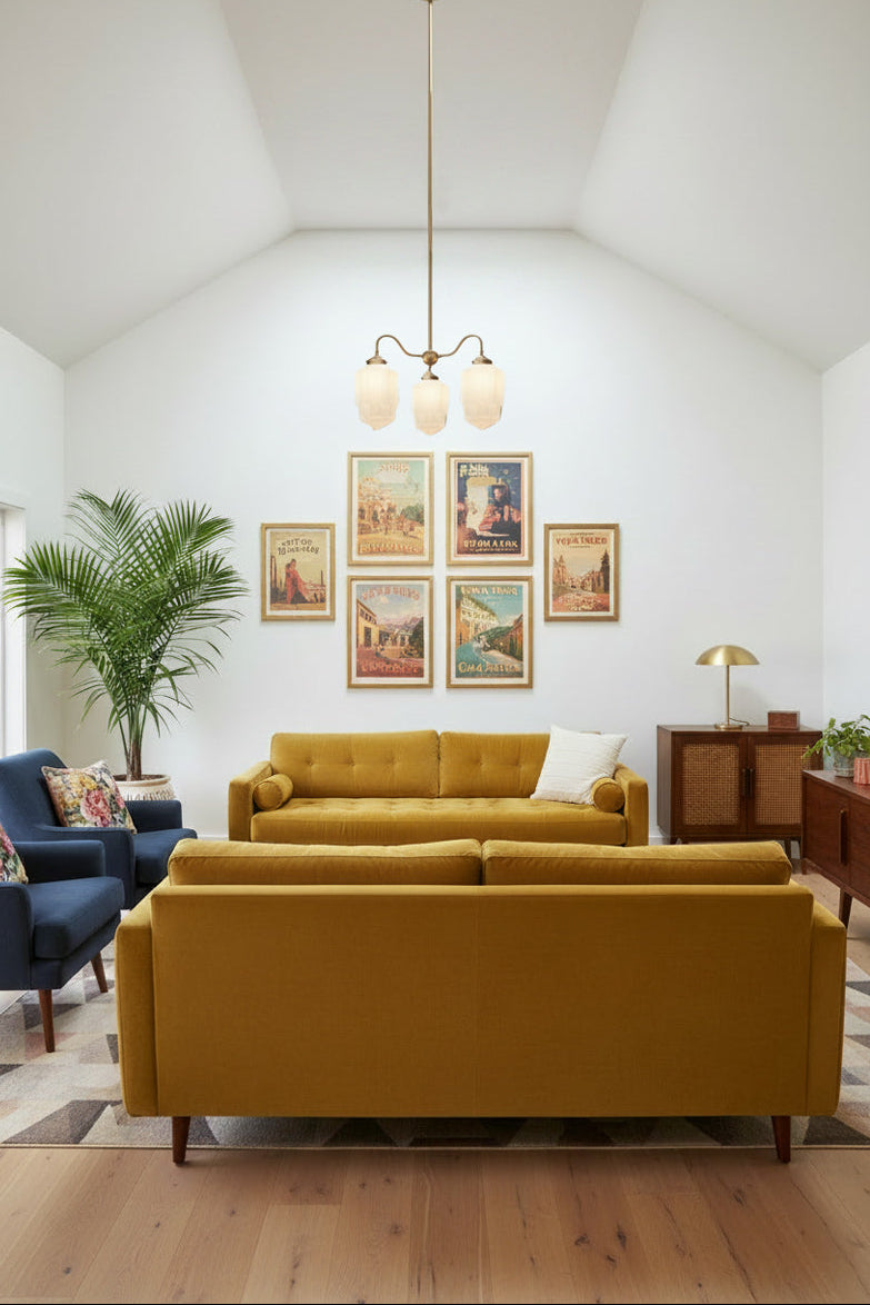 Three gooseneck arm pendant light in gold/ brasswith three large opal glass shades with an Art Deco influence, hanging in bright, eclectic lounge room. 