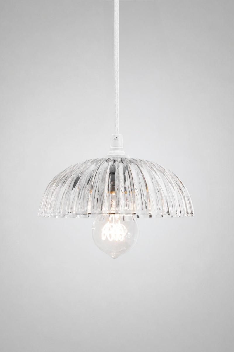 Deloraine clear glass pendant light on a white pendant cord.