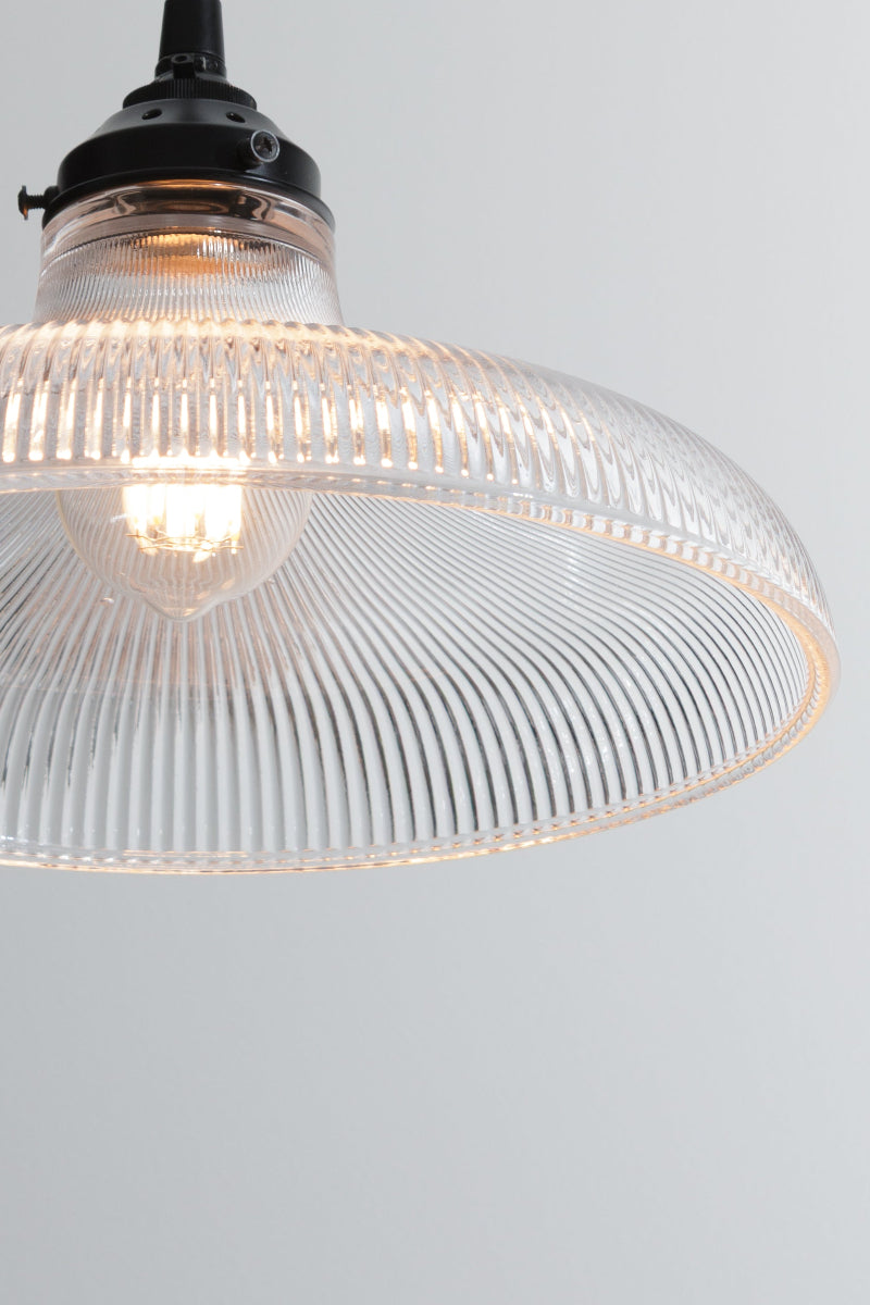large glass shade on black pendant