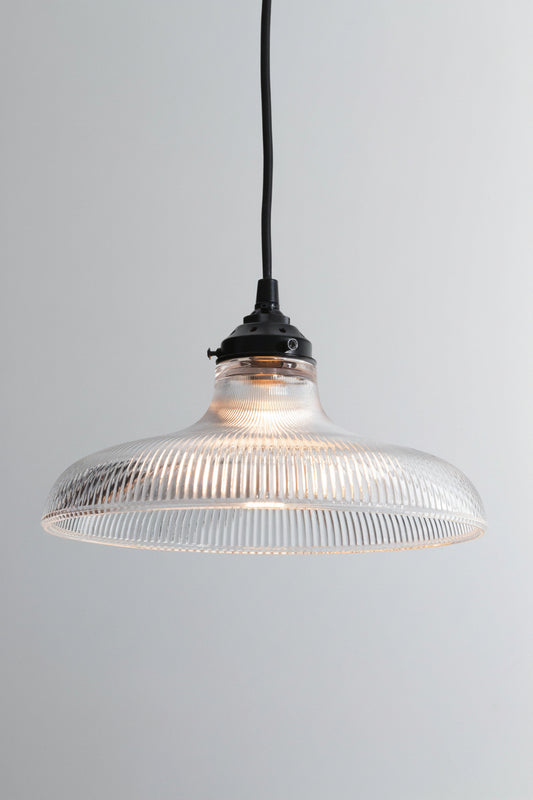 Large clear holohpane glass shade on a black braided cloth cord with black hardware. 