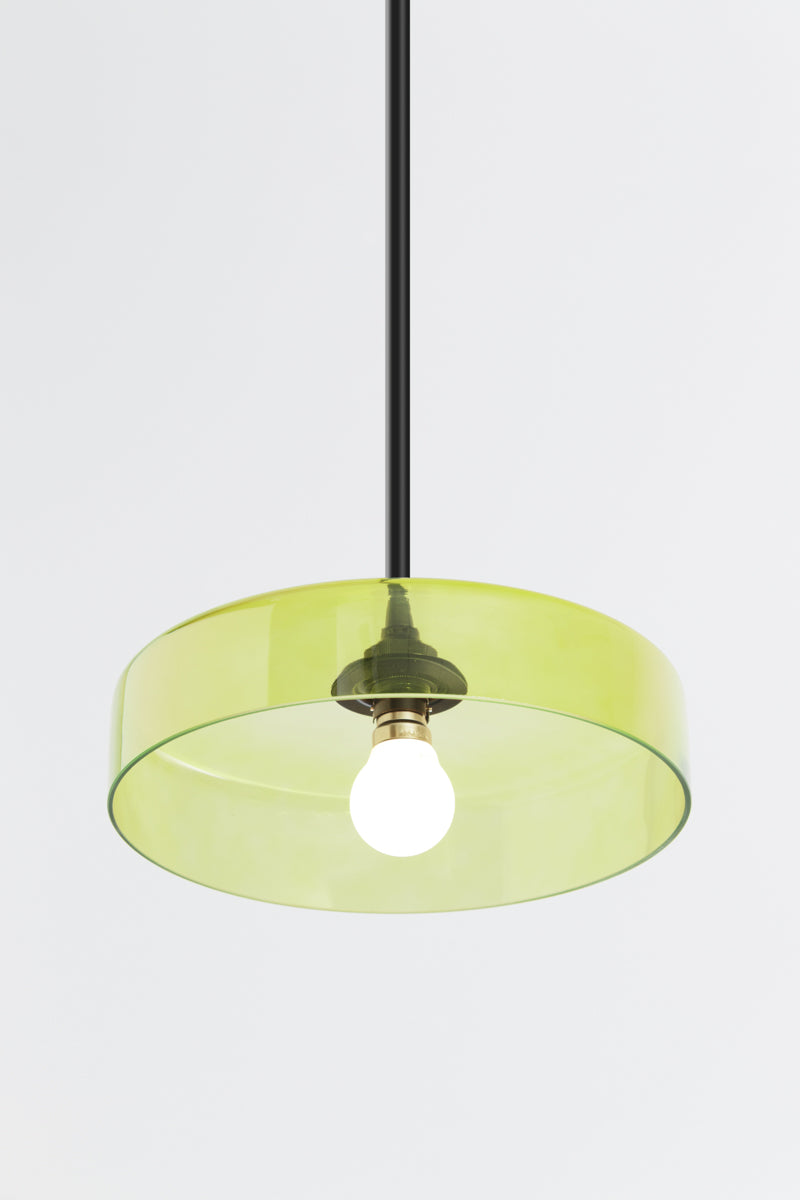 green glass shade on pole pendant  saturating a surface with light without obscuring it 
