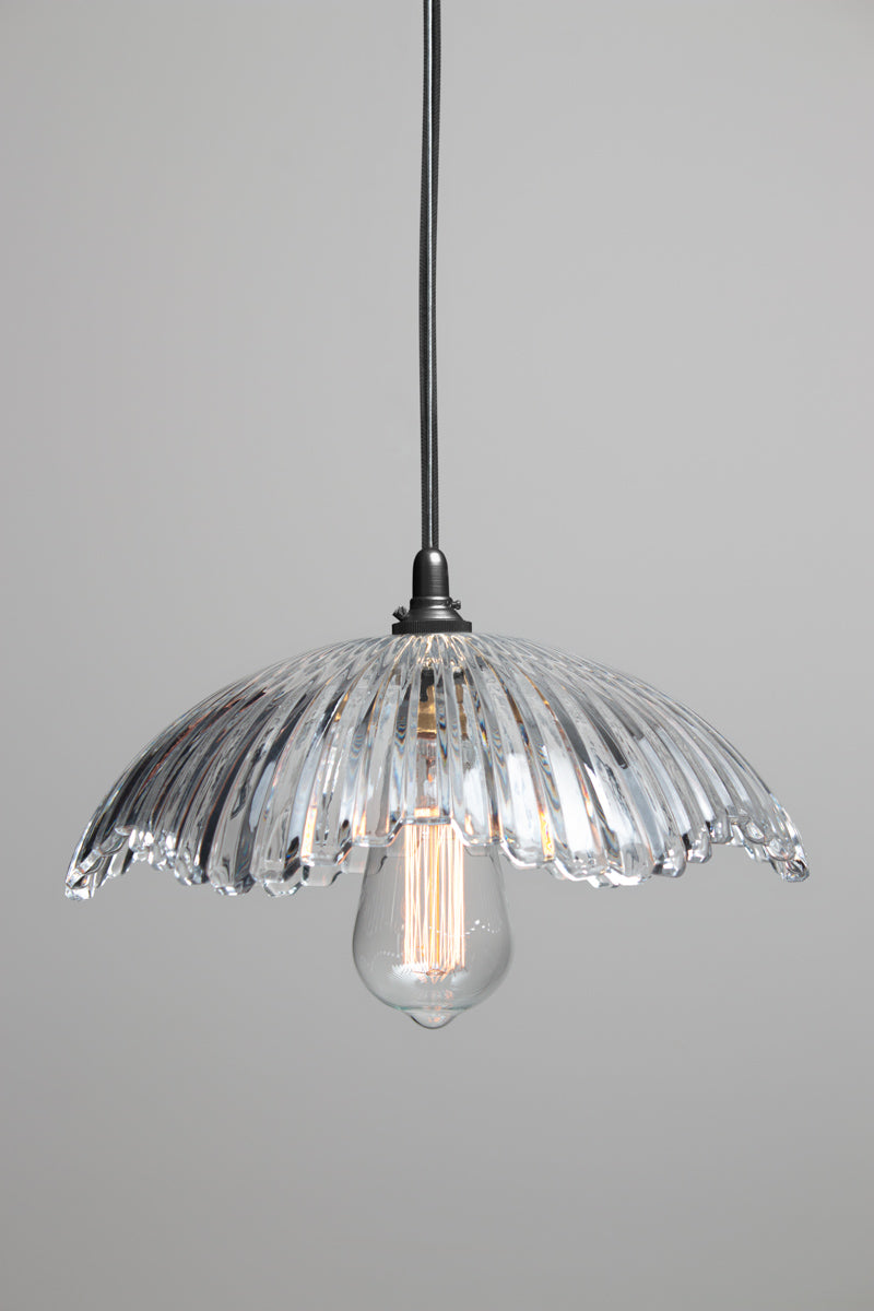 Hepburn Glass Pendant Light with clear fluted glass shade, black lampholder and exposed decorative bulb
