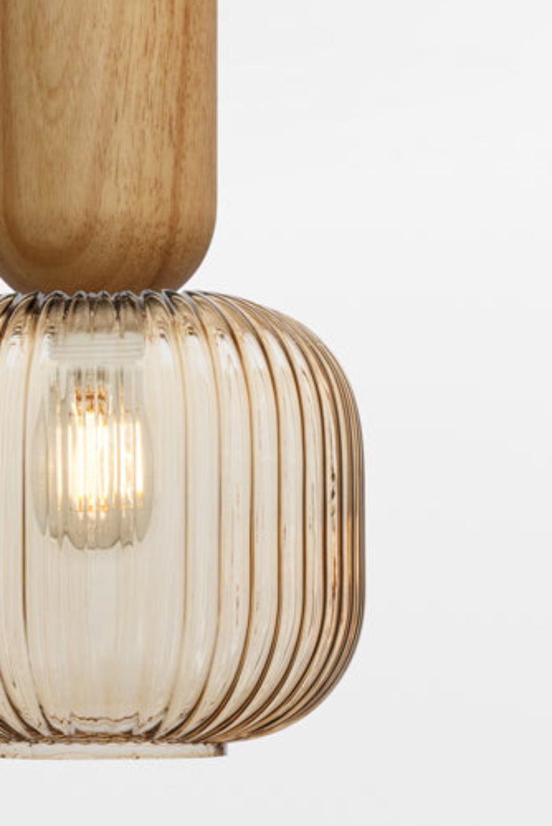 amber shade paired with pendant cord made out of natural wood, timber.