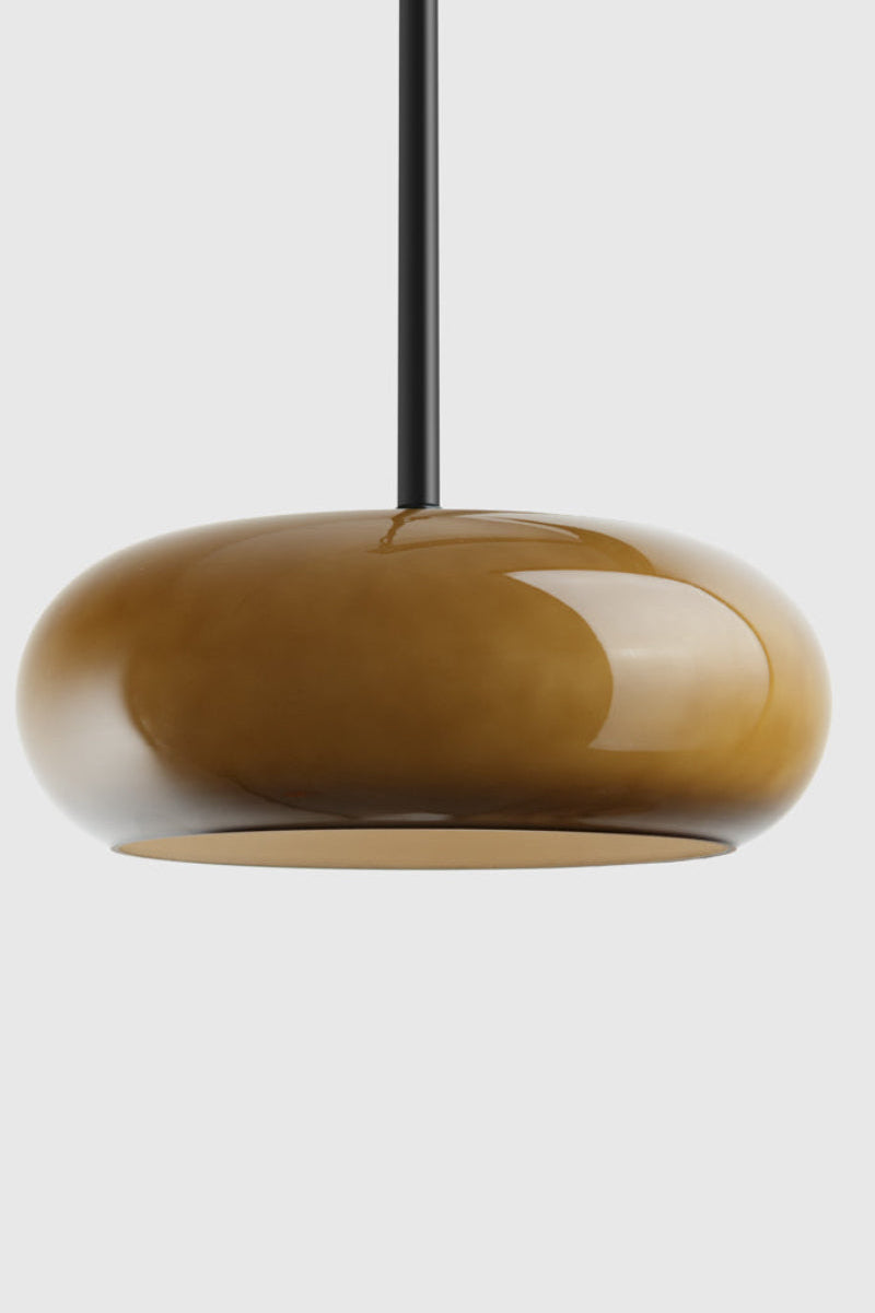 Green pendant light on a black pole pendant 