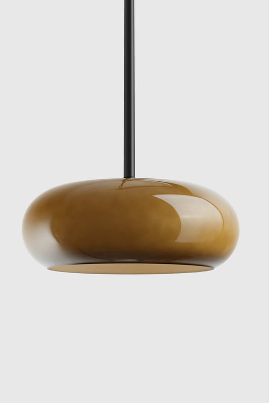 Green pendant light on a black pole pendant 