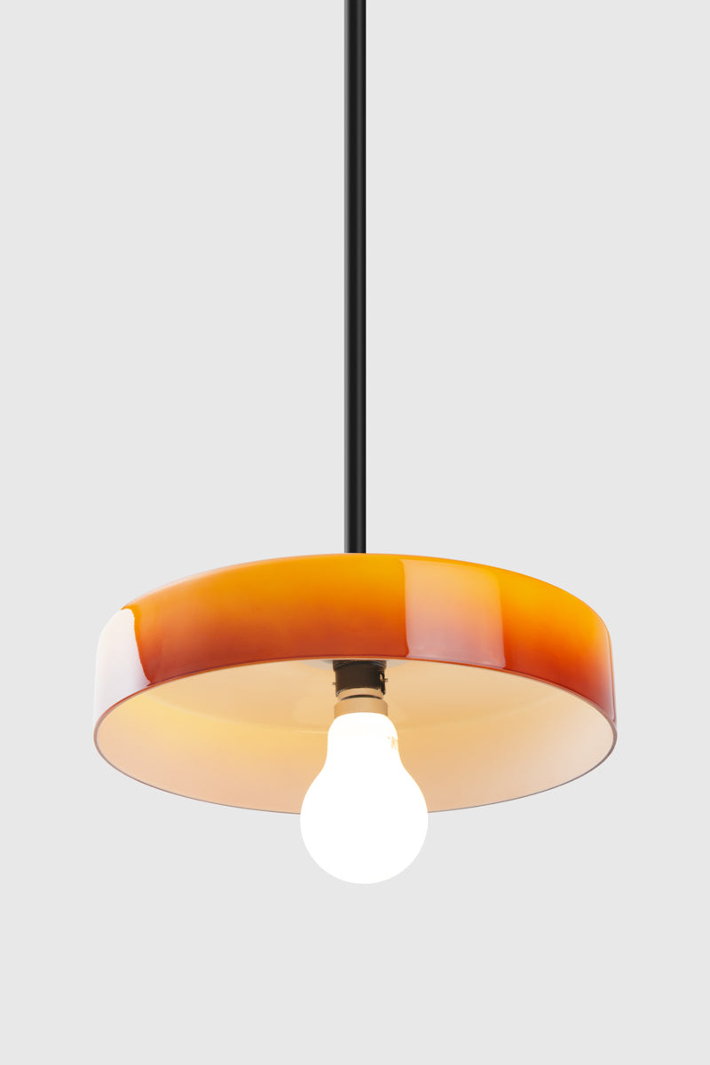 Black pole pendant with amber ombre glass shade. 