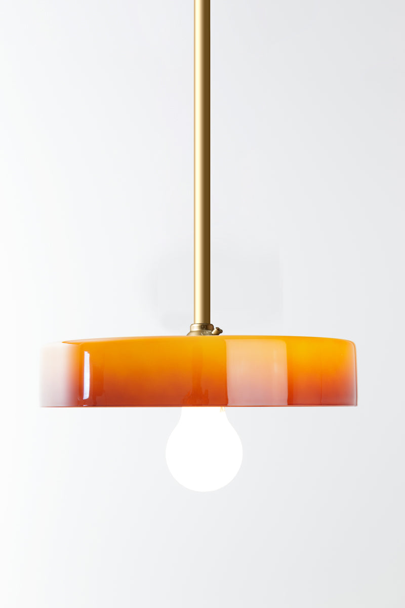 Gold pole pendant with orange onbre glass shade and opal bulb. 
