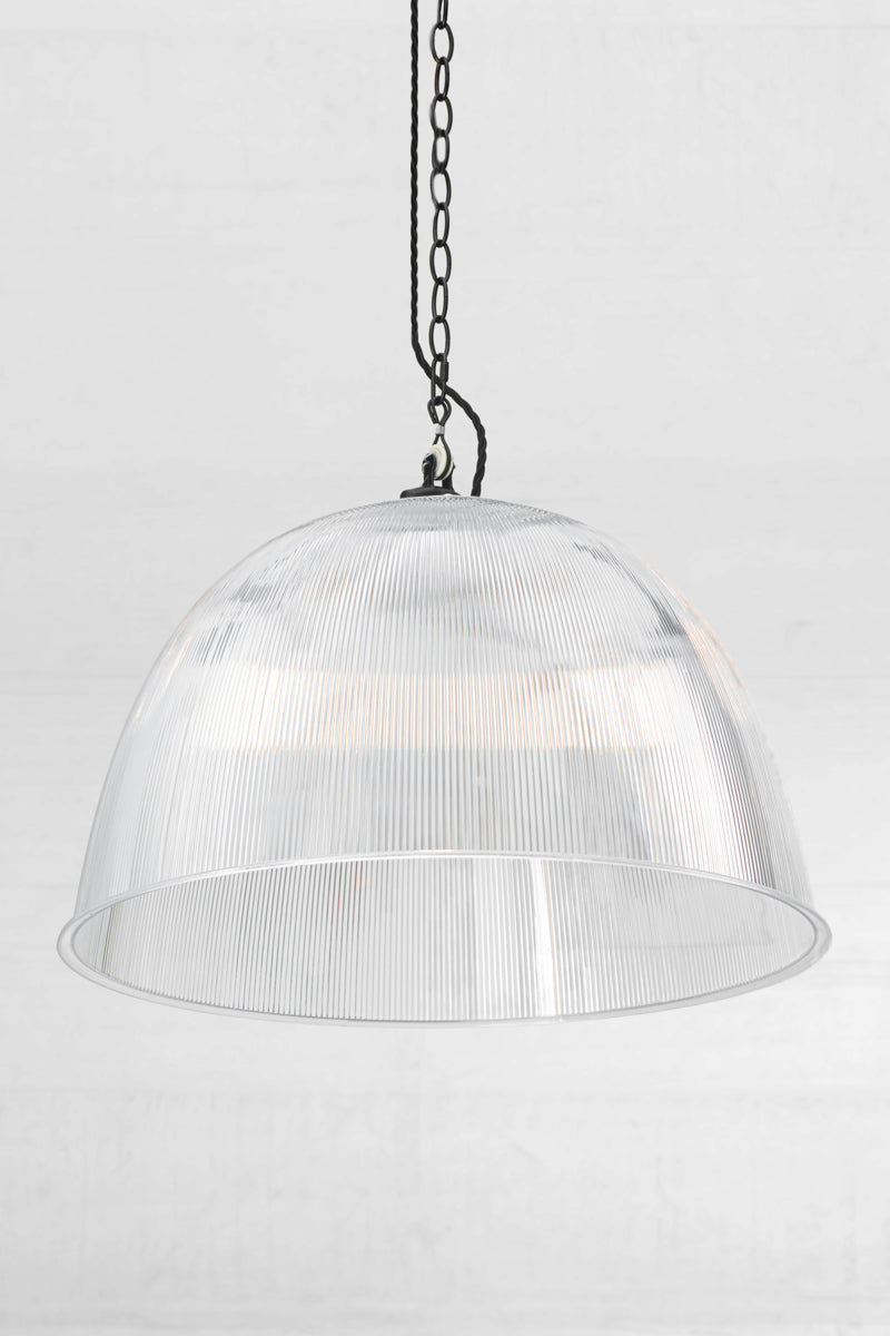 Angled view of the large clear prismatic pendant with black chain style pendant suspension