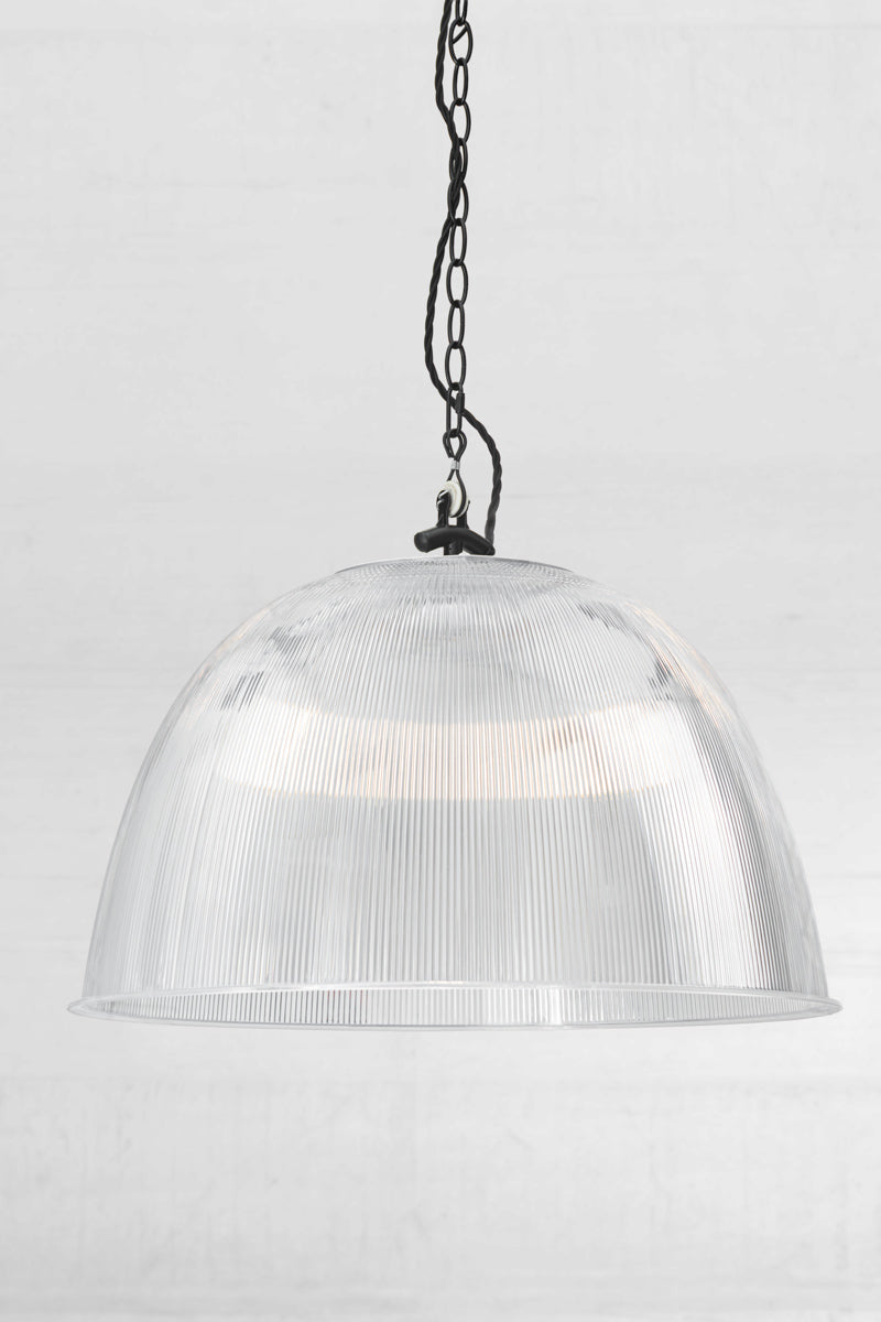 Large clear prismatic pendant with black industrial chain style pendant suspension