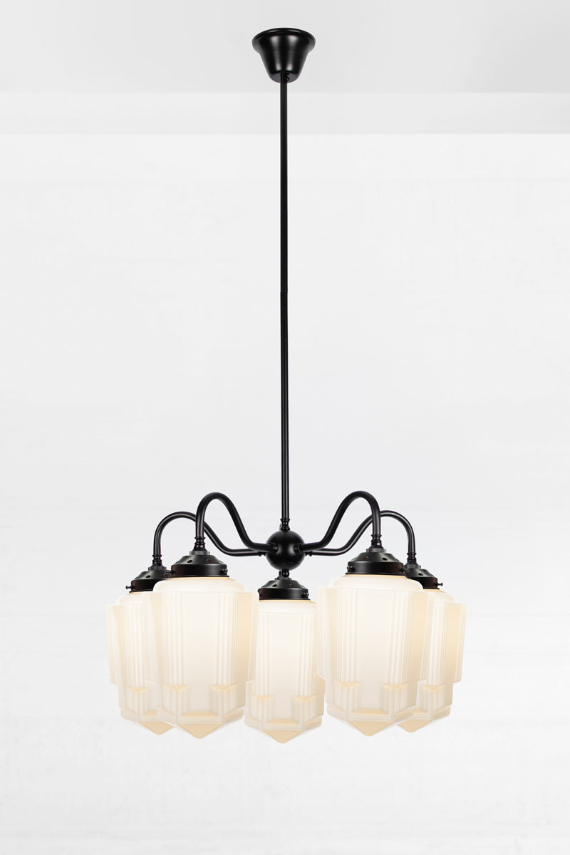 5 light Art Deco opal glass Tivoli shades paired with a black gooseneck chandelier fixture. 