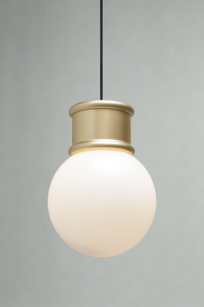 Medium opal glass ball shade paired with a gold/brass topper and pendant cord. 